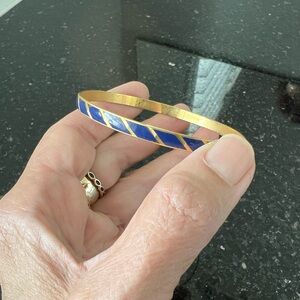Vintage gold tone bangle with blue stripe enamel